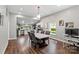 Open dining area with modern lighting, and a view to the kitchen with stainless steel appliances at 85 Ruritan Park Rd, Stony Point, NC 28678
