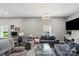 Inviting living room featuring neutral walls, modern lighting, and comfortable seating at 85 Ruritan Park Rd, Stony Point, NC 28678