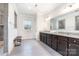 Bathroom featuring modern gray tile floors, gray cabinets, double sinks, and a walk in shower at 9032 Cornflower Dr, Harrisburg, NC 28075