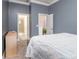 Neutral bedroom features plush carpet and direct access to bathroom and closet at 9032 Cornflower Dr, Harrisburg, NC 28075