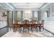 Bright dining room featuring hardwood floors, decorative lighting, and a large table at 9032 Cornflower Dr, Harrisburg, NC 28075