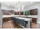 Gourmet kitchen featuring a large center island, granite countertops, and stainless steel appliances at 9032 Cornflower Dr, Harrisburg, NC 28075