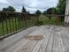 Wooden back deck overlooking green backyard and trees at 936 New Camp Creek Church Rd # 11, Kings Mountain, NC 28086