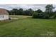 Sprawling backyard featuring lush greenery, a wooden fence, and views of the wooded area at 936 New Camp Creek Church Rd # 11, Kings Mountain, NC 28086