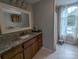 Bathroom featuring granite countertops, wood cabinets, tile floors, and a shower at 936 New Camp Creek Church Rd # 11, Kings Mountain, NC 28086