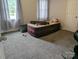 Cozy bedroom with neutral carpet, natural light, and a comfortable inflatable mattress at 936 New Camp Creek Church Rd # 11, Kings Mountain, NC 28086