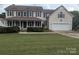 Charming two-story home with a covered front porch and manicured lawn at 936 New Camp Creek Church Rd # 11, Kings Mountain, NC 28086