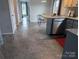 Kitchen view includes granite countertops, gray flooring, and stainless steel dishwasher at 936 New Camp Creek Church Rd # 11, Kings Mountain, NC 28086