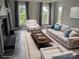 Bright living room with modern furniture, fireplace, and views from windows at 936 New Camp Creek Church Rd, Kings Mountain, NC 28086