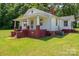 Charming two-story home with a covered front porch, brick foundation, and a spacious green lawn at 1070 Nc 182 Hwy, Lincolnton, NC 28092