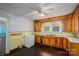 Vintage kitchen featuring wooden cabinets, laminate countertop and classic tile backsplash at 1070 Nc 182 Hwy, Lincolnton, NC 28092