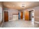 Spacious living room with fireplace, multiple doorways, and decorative tile flooring at 1070 Nc 182 Hwy, Lincolnton, NC 28092