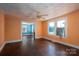 Living room showing hardwood floors, colorful walls, and multiple windows bringing in natural light at 1070 Nc 182 Hwy, Lincolnton, NC 28092