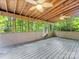 Relaxing screened-in porch with wooded views and a comfortable hammock swing at 10710 Bristlecone Ct, Mint Hill, NC 28227