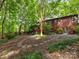 Expansive backyard showcasing a two-story home with meticulous landscaping at 10710 Bristlecone Ct, Mint Hill, NC 28227