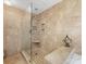Tiled walk-in shower with bench and a glass door, a luxurious spa-like experience at 10710 Bristlecone Ct, Mint Hill, NC 28227