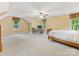 Large bedroom with light paint, carpet, lots of natural light, a ceiling fan and work space at 10710 Bristlecone Ct, Mint Hill, NC 28227