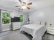 Bedroom with carpet, neutral paint, a ceiling fan, and large windows with views at 10710 Bristlecone Ct, Mint Hill, NC 28227