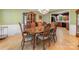 Beautiful dining room with hardwood floors, large table, and elegant china cabinet at 10710 Bristlecone Ct, Mint Hill, NC 28227