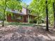 Charming two-story home featuring a full front porch and lush green surroundings at 10710 Bristlecone Ct, Mint Hill, NC 28227