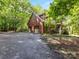 Charming home exterior featuring an attached two-car garage and welcoming front porch at 10710 Bristlecone Ct, Mint Hill, NC 28227