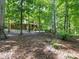 Secluded home exterior surrounded by mature trees, offering privacy and natural beauty at 10710 Bristlecone Ct, Mint Hill, NC 28227