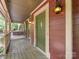 Cozy front porch with swing, offering a relaxing space with views of the surrounding greenery at 10710 Bristlecone Ct, Mint Hill, NC 28227