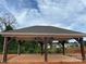 Outdoor structure featuring a covered seating area, perfect for relaxation and entertaining at 108 Red Juniper Way, Statesville, NC 28625