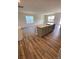 Open-concept kitchen flows into the living room, featuring wood-look flooring and abundant natural light at 108 Red Juniper Way, Statesville, NC 28625