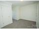 Spacious bedroom featuring neutral carpet and two closets for storage at 1083 Elljoy Ln, Salisbury, NC 28146