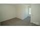 Bright bedroom featuring neutral carpet, a window, and a closet at 1083 Elljoy Ln, Salisbury, NC 28146