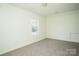 Neutral bedroom with a window and tan carpet at 1083 Elljoy Ln, Salisbury, NC 28146