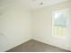 Bedroom featuring neutral carpet, a window, and shelving at 1083 Elljoy Ln, Salisbury, NC 28146