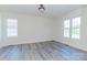 Neutral bedroom with two windows and grey floors at 1083 Elljoy Ln, Salisbury, NC 28146