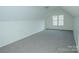 Bonus room featuring a window and neutral carpet at 1083 Elljoy Ln, Salisbury, NC 28146