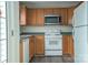 Well-equipped kitchen with stainless steel appliances, ample wood cabinetry, and modern flooring at 1083 Elljoy Ln, Salisbury, NC 28146