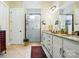 Bathroom with a walk-in shower, granite countertops, dual sinks, and vanity at 10903 Skymont Dr, Huntersville, NC 28078