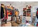 Walk-in closet with custom shelving, drawers, and a mirrored island at 10903 Skymont Dr, Huntersville, NC 28078