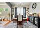 Dining area features modern chandelier, decor, and stylish mirror accent at 10903 Skymont Dr, Huntersville, NC 28078