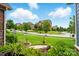 Green front lawn with landscaped garden beds and a sidewalk at 10903 Skymont Dr, Huntersville, NC 28078