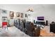 Home theater features reclining seating, movie posters, ceiling fan, and a tv at 10903 Skymont Dr, Huntersville, NC 28078