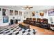 Spacious home theater featuring leather recliners, movie posters, and a ceiling fan for comfortable entertainment at 10903 Skymont Dr, Huntersville, NC 28078