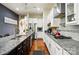 A kitchen with granite countertops, stainless appliances, and white cabinetry at 10903 Skymont Dr, Huntersville, NC 28078