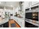 A kitchen with granite countertops, stainless appliances, and white cabinetry at 10903 Skymont Dr, Huntersville, NC 28078