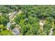 Aerial view of a treed neighborhood with lake access, offering both privacy and community at 1102 Lake Montonia Rd, Kings Mountain, NC 28086