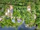 Aerial view of homes near a lake surrounded by lush greenery at 1102 Lake Montonia Rd, Kings Mountain, NC 28086