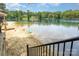 Sandy beach access with calm, clear water, perfect for swimming and relaxing by the lakeside at 1102 Lake Montonia Rd, Kings Mountain, NC 28086
