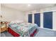 Bedroom featuring a double bed, blue carpet, white walls, and built-in storage at 1102 Lake Montonia Rd, Kings Mountain, NC 28086