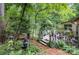 Outdoor deck and patio surrounded by lush greenery, perfect for relaxation at 1102 Lake Montonia Rd, Kings Mountain, NC 28086