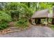 Stone driveway with steps leading to the house through lush greenery at 1102 Lake Montonia Rd, Kings Mountain, NC 28086